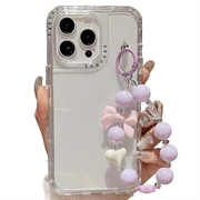 iPhone 16 Pro Max Glitter Iskunkestävä hybridi kotelo rannehihnalla - läpinäkyvä
